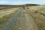 Lottie and Peter on the long track up Cross Fell