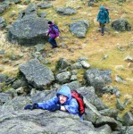 Tim scrambling onto Harter Fell's summit