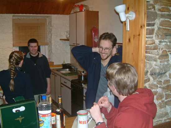 20031228-203442.jpg - Meeting in the cottage: Lottie, Ian, Tim and Peter