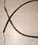 Start with a filthy platypus tube like this one, and thread some wire through it