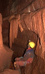 Dave admires a stalactite in the passage