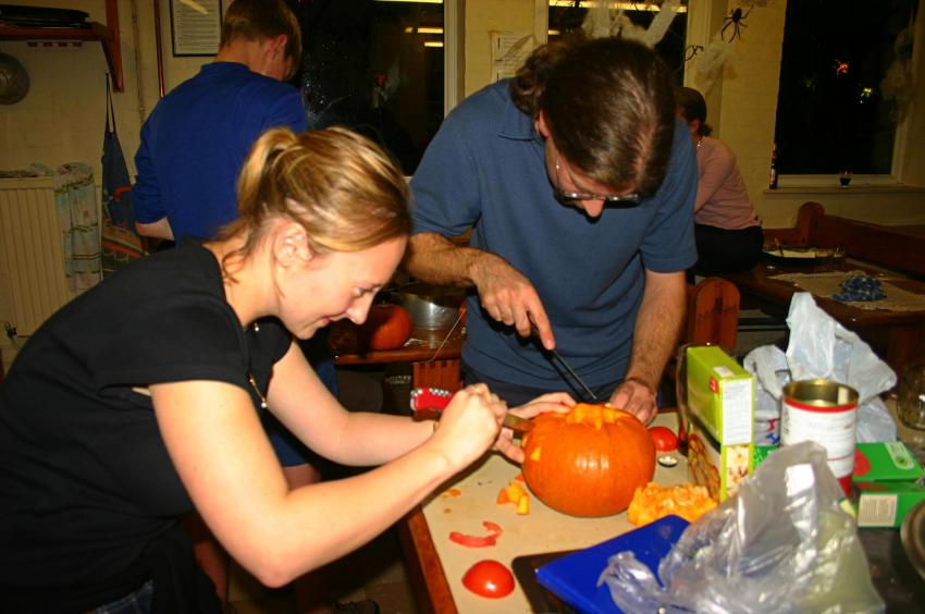 20051029-223730.jpg - Lisette and Robin carve pumpkins