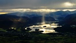 Shafts of light pick out islands on Derwent Water