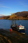 Caisteal Maol and Kyleakin harbour with boat being unloaded