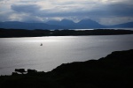 A boat sails through Caolas Mor, between the mainland and the Crowlin Islands